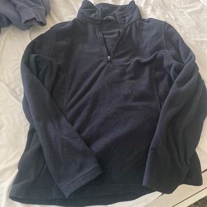 Black fleece jacket size 10-12 (fits perfect for a medium) and zips in the front
